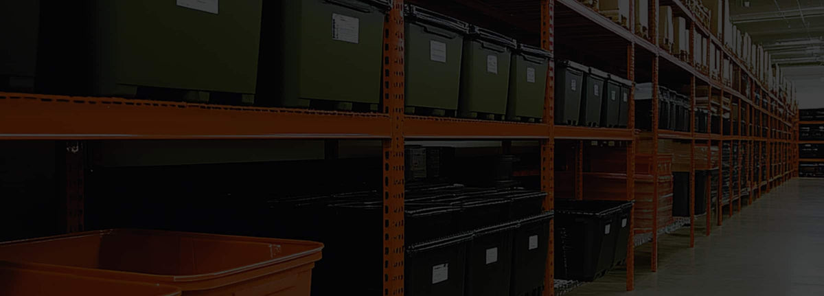 Pallet rack storing bins and totes