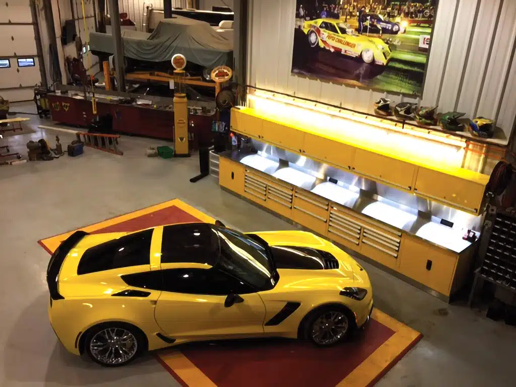 Organized garage storage system with a yellow sports car